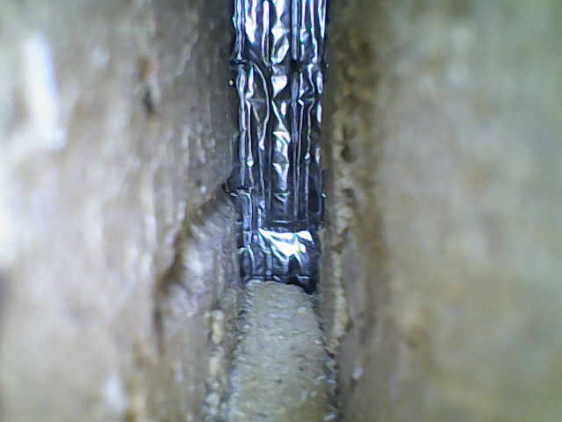 Borescope image used to inspect concealed construction defect